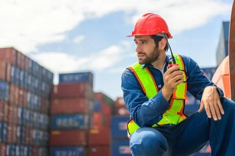 Warehouse engineer working at container yard Stock Photos