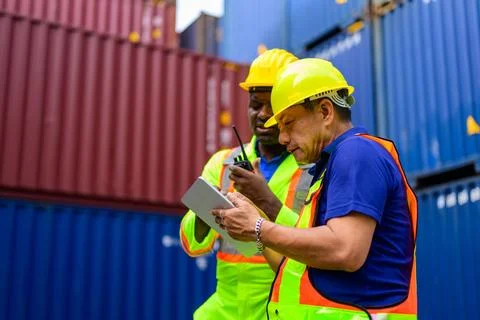 Warehouse engineer working at container yard Stock Photos