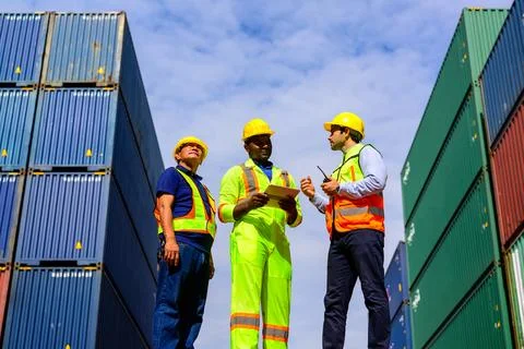 Warehouse engineer working at container yard Stock Photos