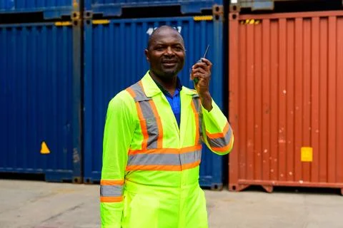 Warehouse engineer working at container yard Stock Photos