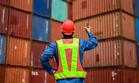 Warehouse engineer working at container yard Stock Photos
