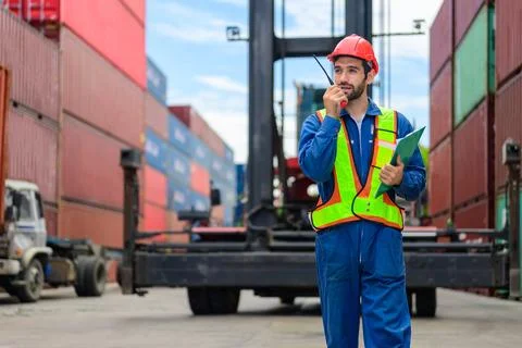 Warehouse engineer working at container yard Stock Photos