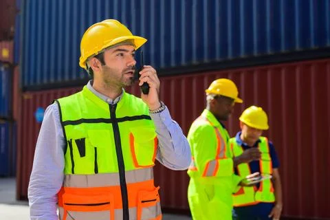 Warehouse engineer working at container yard Stock Photos