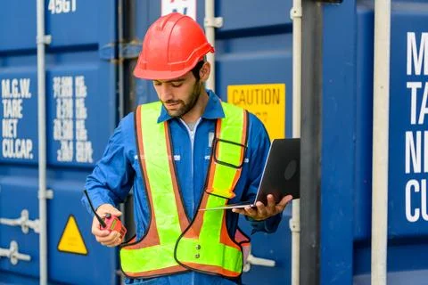 Warehouse engineer working at container yard Stock Photos