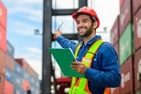 Warehouse engineer working at container yard Stock Photos
