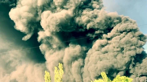 Warehouse engulfed in raging fire with huge column of smoke Stock Footage 78492822