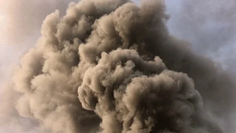 Warehouse engulfed in raging fire with huge column of smoke Stock Footage 78492873