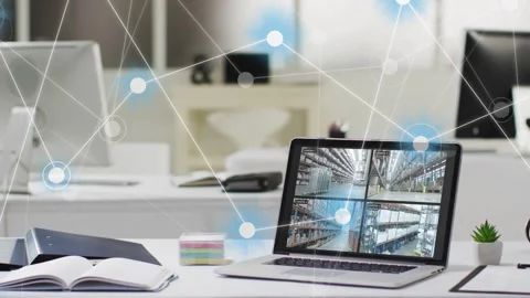 Warehouse feed starting network overlay, laptop showing four feeds while nodes Stock Footage 334321893