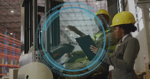 Warehouse forklift driver pointing pallets causing scan overlay while supervisor Stock Footage 309895641