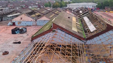 Warehouse framework demolition aerial view over former Glen Dimplex site Stock Footage 345405440