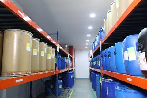 Warehouse full of containers on rack for storage in pharmaceutical Stock Photos