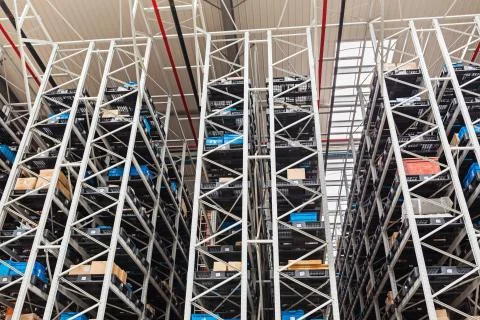 The warehouse full of goods, boxes and shelves in order. Industrial backgroun Stock-Fotos