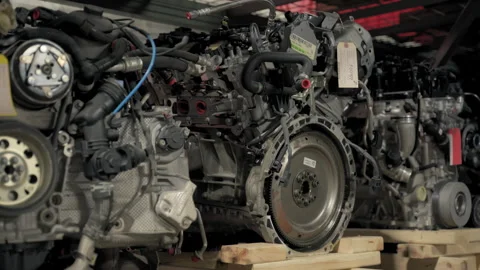 Warehouse interior of OEM used auto parts pile of old car at garage factory Stock-Footage 303786995