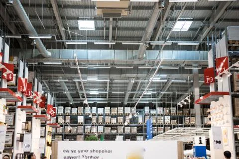 Warehouse interior with racks and boxes. Interior shot of a warehouse with hi Stock Photos