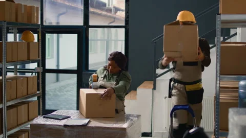 Warehouse intern seals boxes parcels 스톡 동영상 250570061