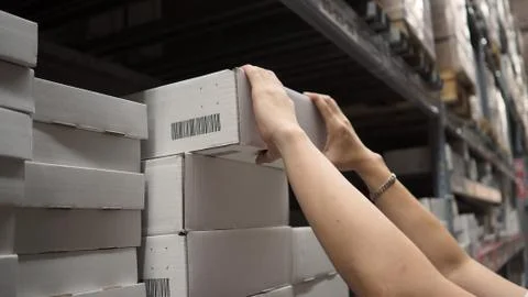 Warehouse large storage or logistic or cargo for distribution. and man's hand Stock Photos