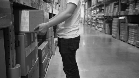 Warehouse large storage or logistic or cargo for distribution. and man's hand Stock Photos
