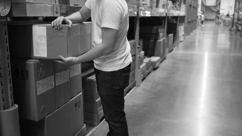 Warehouse large storage or logistic or cargo for distribution. and man's hand Stock Photos