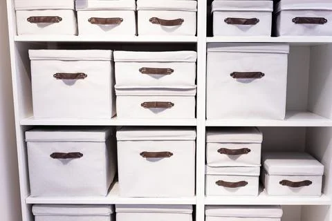 Warehouse loaded with boxes.stack of white textile office boxes. selective focus 스톡 사진