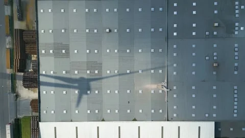 Warehouse logistics operations below motion reveals rooftop design functionality 動画素材 285718917