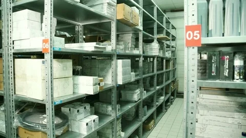 In a warehouse man with a document found with the desired cell box Stock Footage 75318730