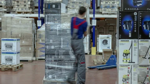 Warehouse, man stretching boxes. Motion time lapse. UHD 4K Stock Footage 120515148