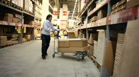 Warehouse. Man takes a box. Stock Footage