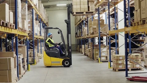 Warehouse man worker with forklift. Stock Footage 82612900
