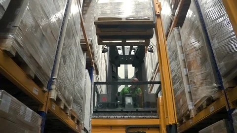 Warehouse man worker with forklift. loader loading goods at shelves. concept Stock Footage 124453598