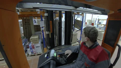 Warehouse man working on loader. Motion time lapse. UHD 4K Stock Footage 120515318