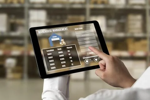 Warehouse management innovative software in computer for real time monitoring Stock Photos