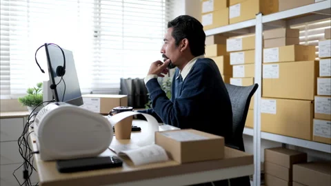 Warehouse manager analyzing data on desktop computer Stock Footage 326275470