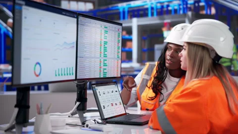 Warehouse Manager And Assistant Use Laptop Stock Footage 345323522