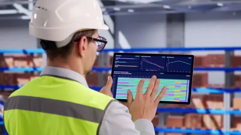 Warehouse Manager Carefully Checks Inventory Data Stock Footage 332500245