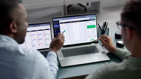 Warehouse Manager Reviews Inventory System With Colleague Stock Footage 345312573