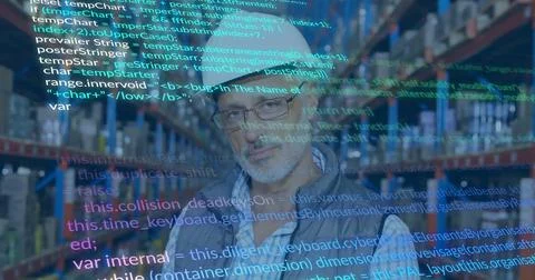 Warehouse manager scanning code overlay appearing and analyzing inventory data Stock Photos