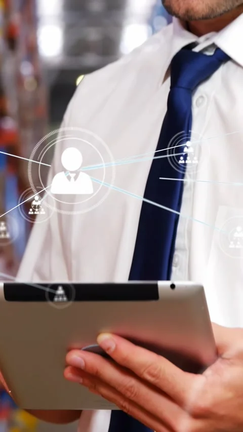 Warehouse manager tapping tablet, animating node network projecting on chest 스톡 동영상 331383205