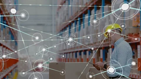 Warehouse manager tapping tablet while logging inventory, generating network Video stock 317331136