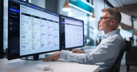 Warehouse Manager Uses Computer Software To Track And Optimize Inventory Ship Stock Photos