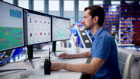 Warehouse Manager Uses Inventory Software For Real-time Tracking Stock Footage 335457929