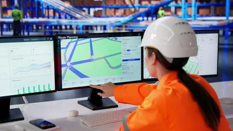 Warehouse Manager Using Computer To Track Stock Footage 334523853