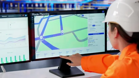 Warehouse Manager Using Computer To Track Stock Footage 334525989