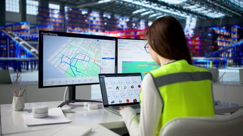 Warehouse Manager Using Computer To Track Parcels 動画素材 334532034