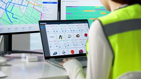 Warehouse Manager Using Computer To Track Parcels 動画素材 335456570