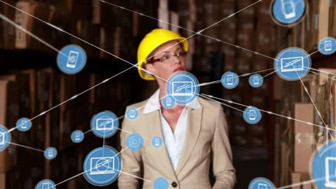 Warehouse manager walking aisle, scanning boxes, activating blue IoT nodes Video stock 332285953