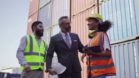 The warehouse manager was talking with a black woman engineer and Foreman. He Video stock 168515977