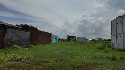 Warehouse in the middle of grass field Stock Footage 342213809