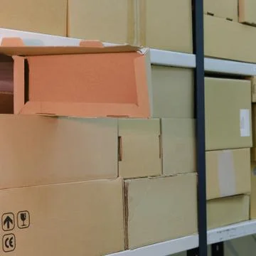 Warehouse with opened boxes. Thief at the mail warehouse Stock Photos