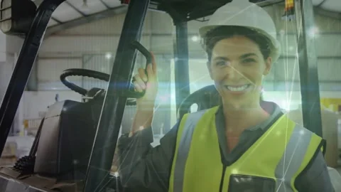 Warehouse operator gripping mast, confident as camera pullback revealing network Stock Footage 331821056