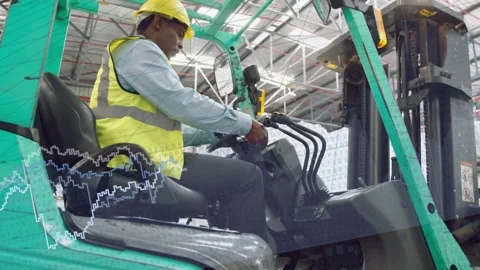 Warehouse operator walking to forklift checking cab sitting prepping levers Stock Footage 334321923